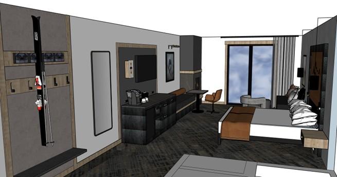 Modern hotel room with ski equipment on the wall, a bed, desk, and large window.