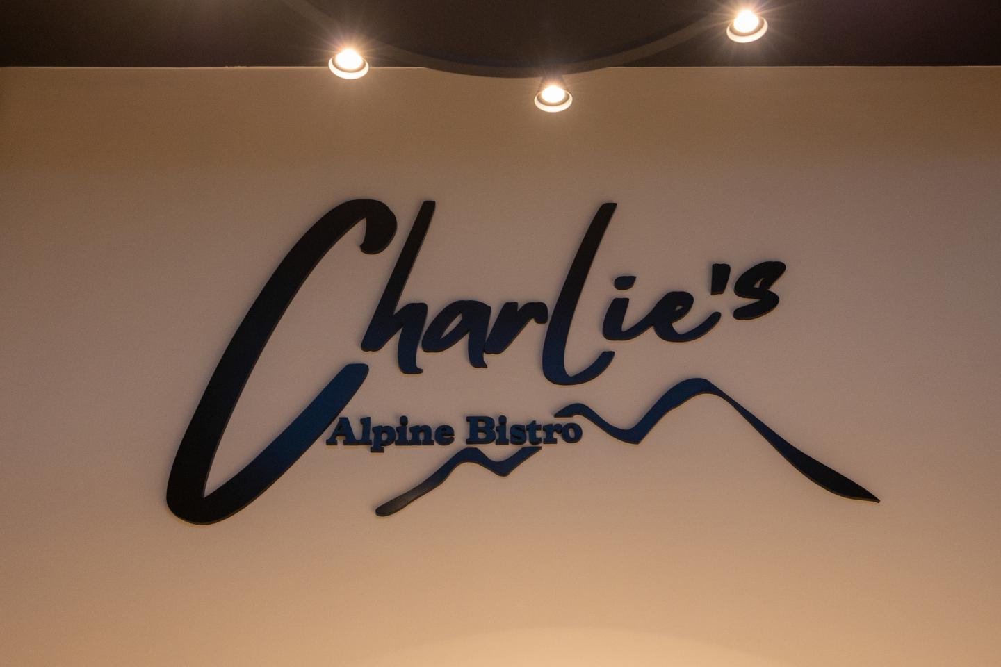 Charlie's Alpine Bistro logo with mountain graphic.