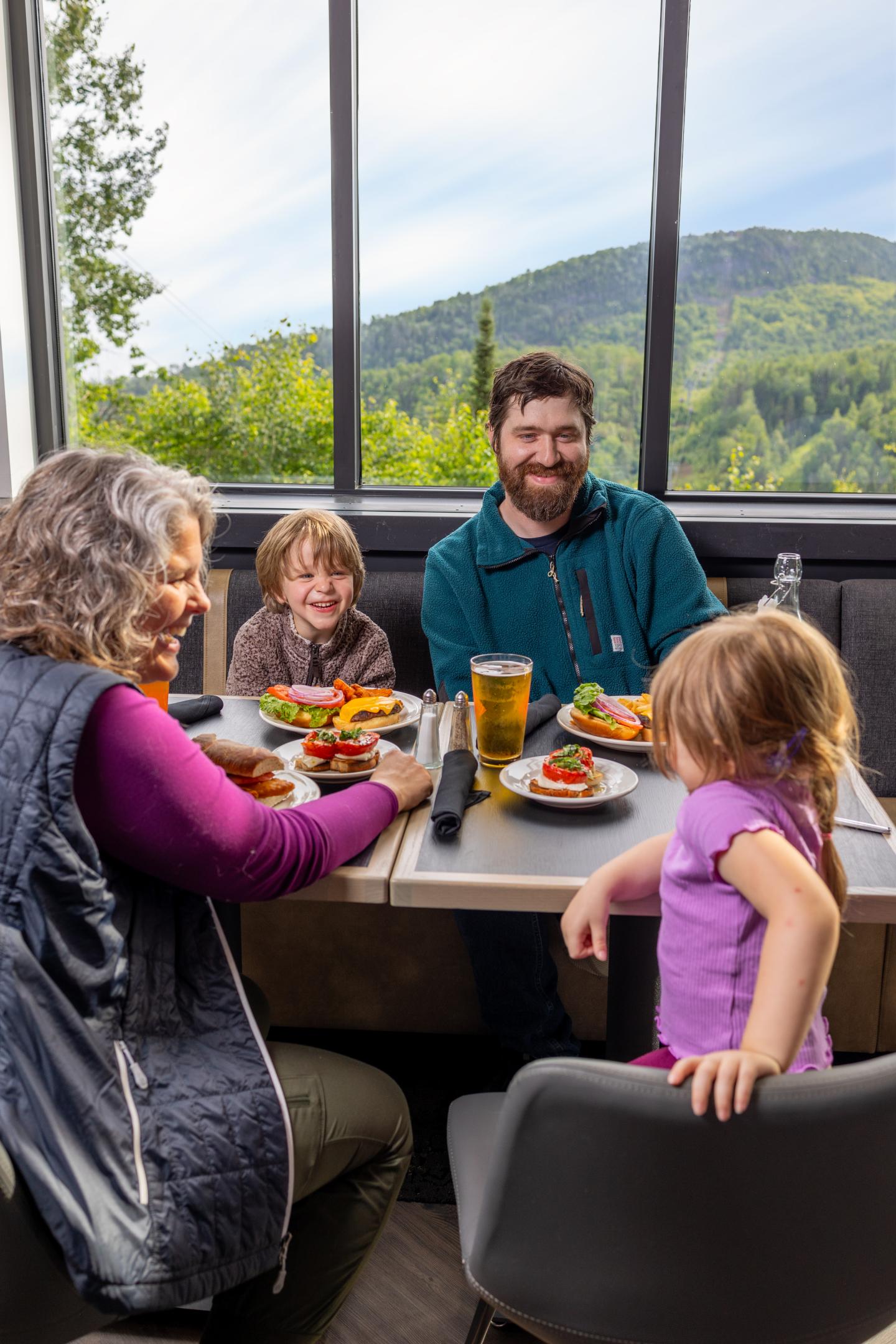 Family dining with mountain view.
